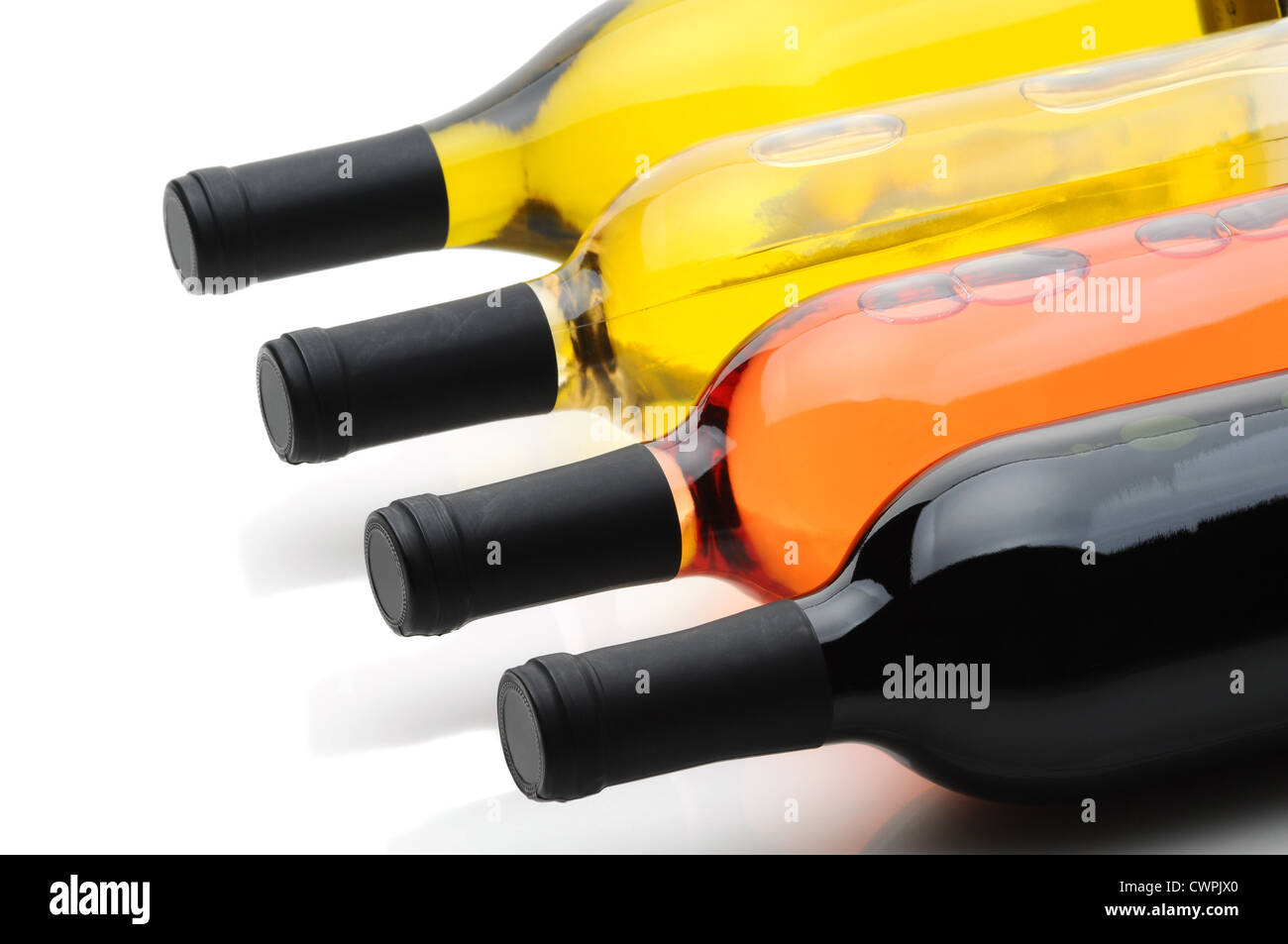 Closeup of four wine bottles laying on their side Stock Photo Alamy
