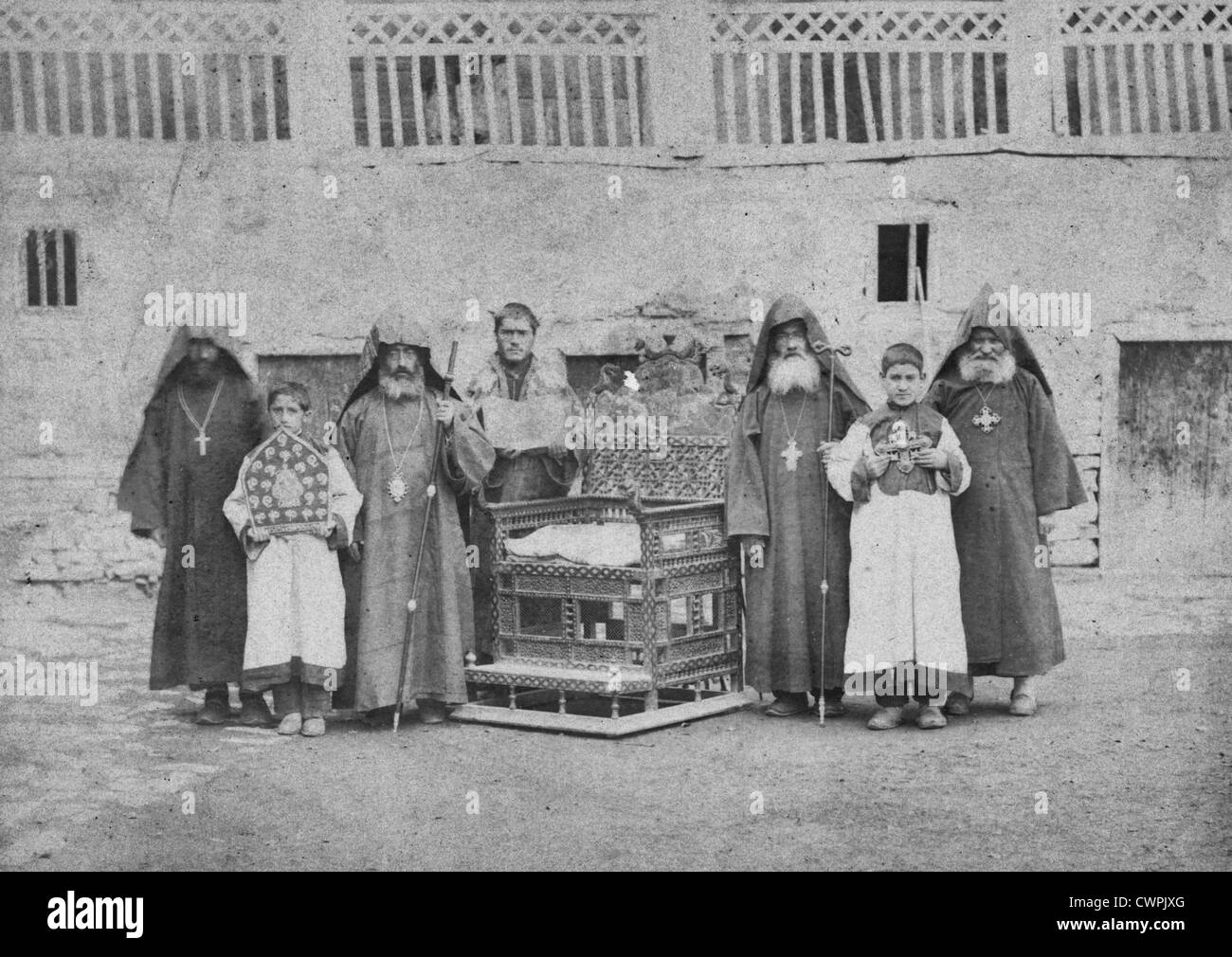 Armenian monks and boys with throne of King Senekerim Hovhannes of Vaspurakan, at Varagavank Monastery, Van, Turkey, Circa 1892 Stock Photo