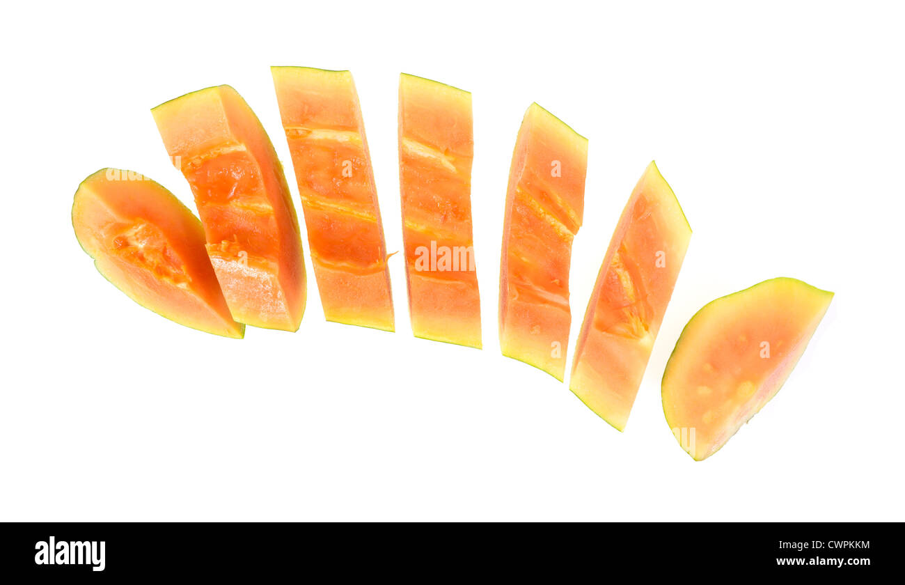 Half of a maradol red papaya in slices on a white background. Stock Photo