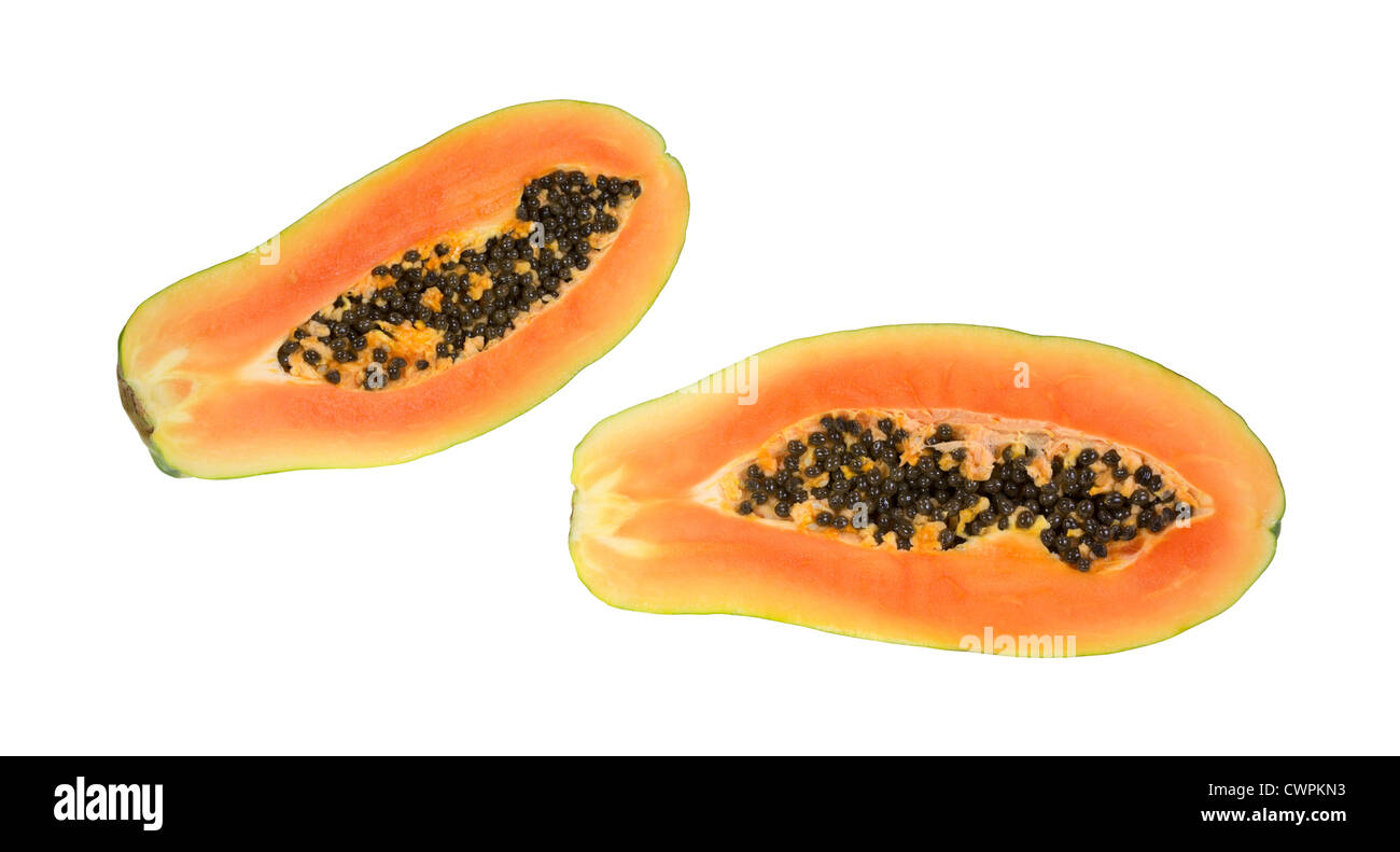 A red maradol papaya that has been cut in half showing both sides with seeds on a white background. Stock Photo