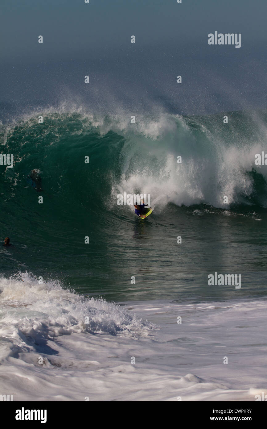 Surfer riding a huge wave at the Wedge Newport Beach California in