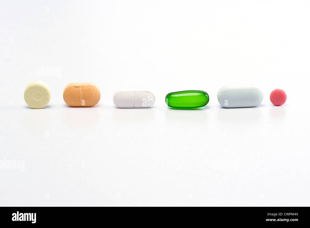 Assorted pills on white background Stock Photo