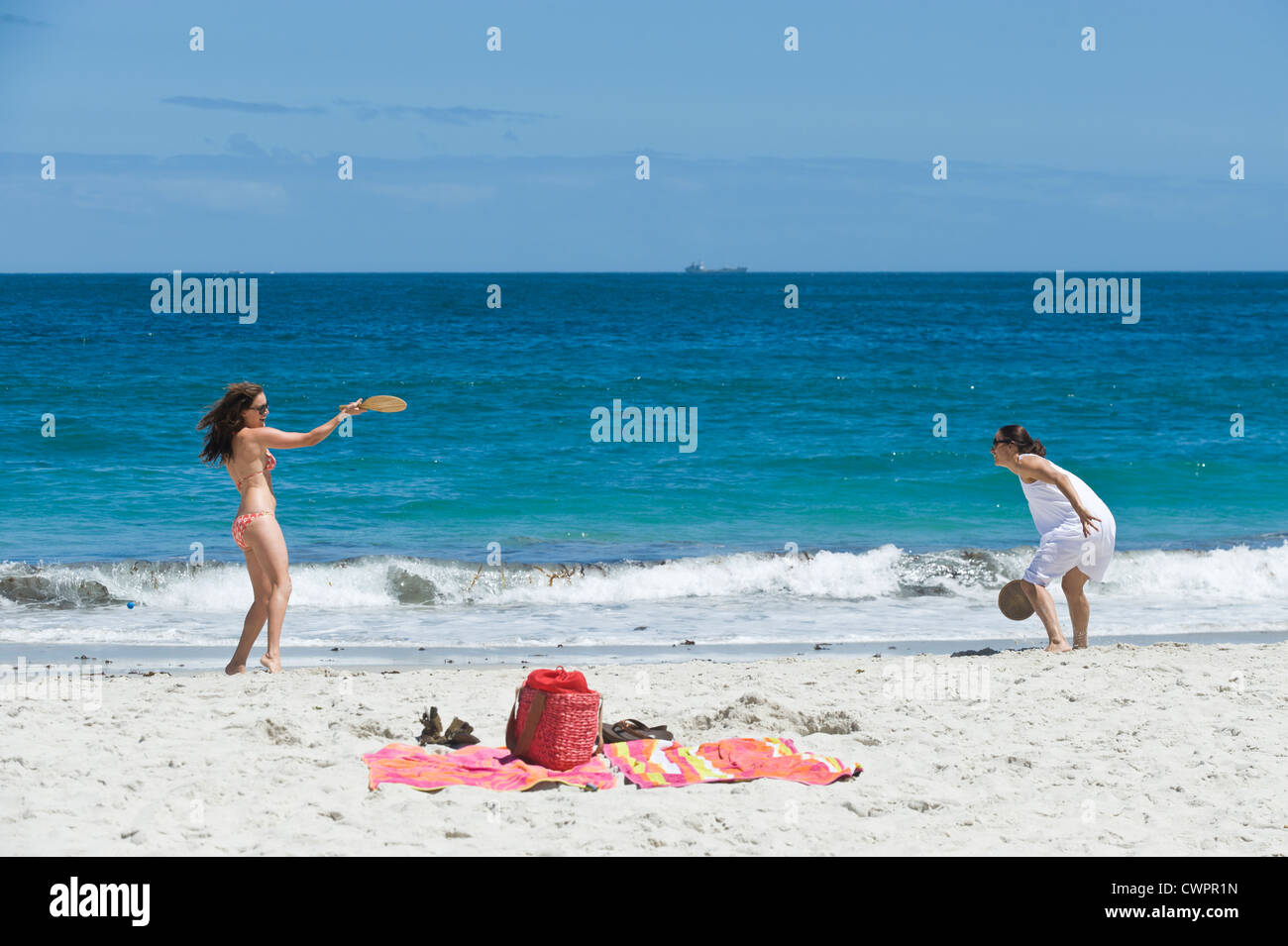 Women playing beach tennis, Camps Bay, Cape Town, South Africa Stock Photo