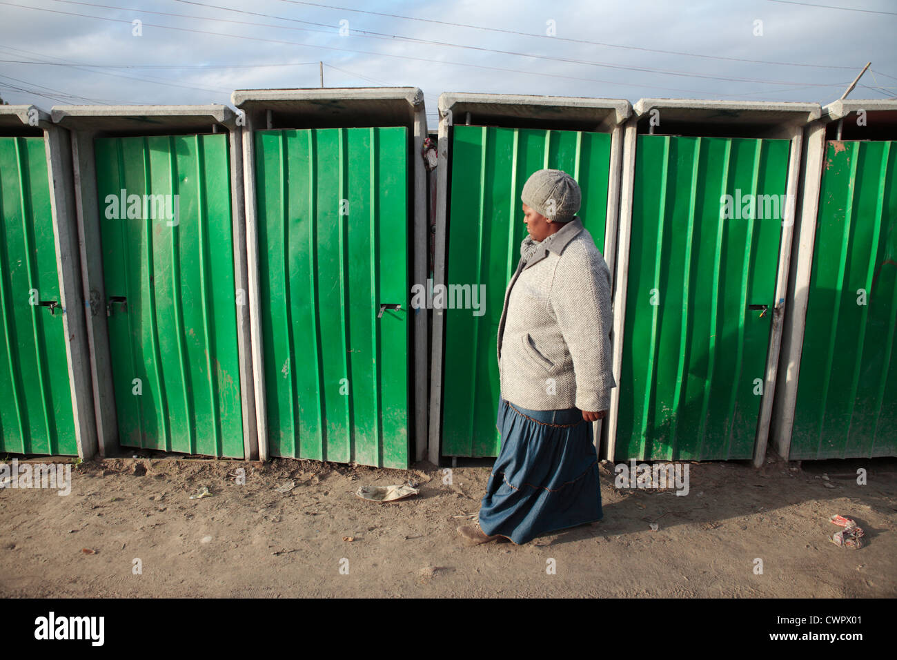 Woman Walking Past Toilets in Khayelitsha, South Africa Stock Photo Alamy