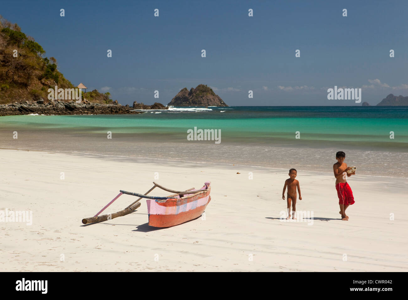 Indonesia, Lombok, South Coast, Seong Blanak, two young boys on the beach Stock Photo