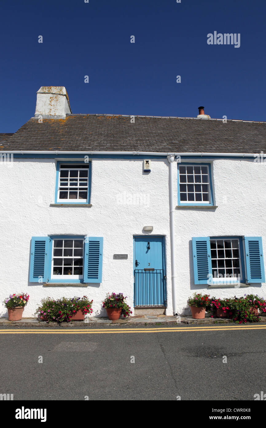 housing stock exterior blue sky sunny, fisherman's terraced white washed stone cottages, St. Mawes, Cornwall, UK Stock Photo