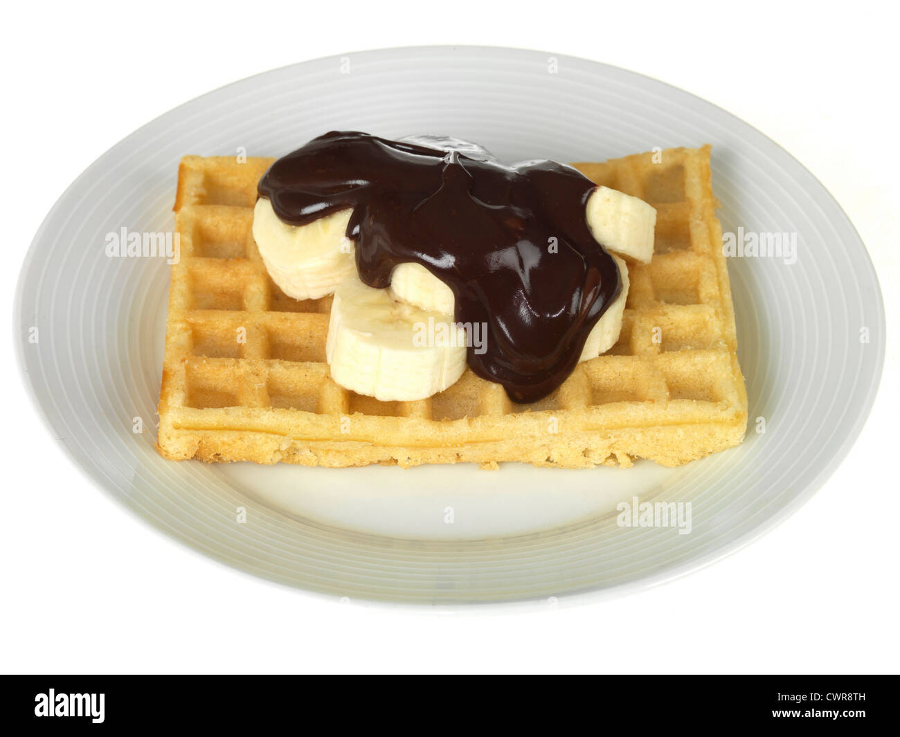 Waffles With Banana And Chocolate Sauce Stock Photo Alamy