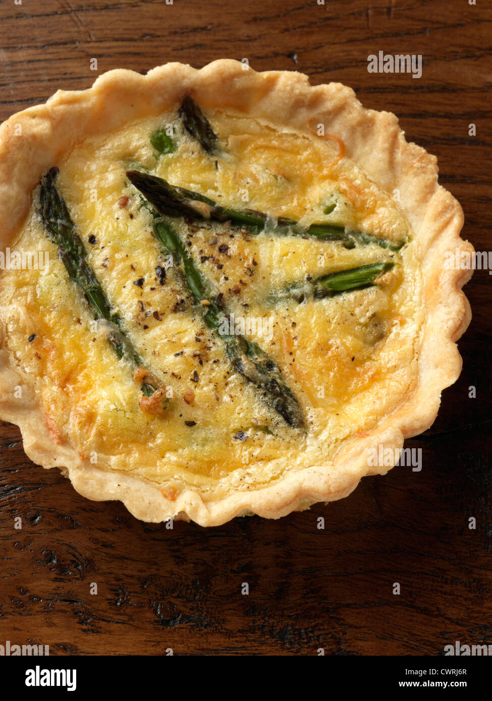 Individual asparagus and pea tart Stock Photo