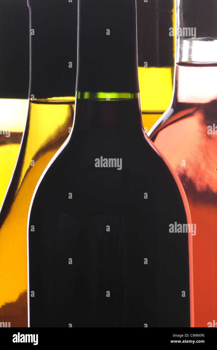 Abstract Close up of Five Different Wine Bottles vertical format Stock Photo