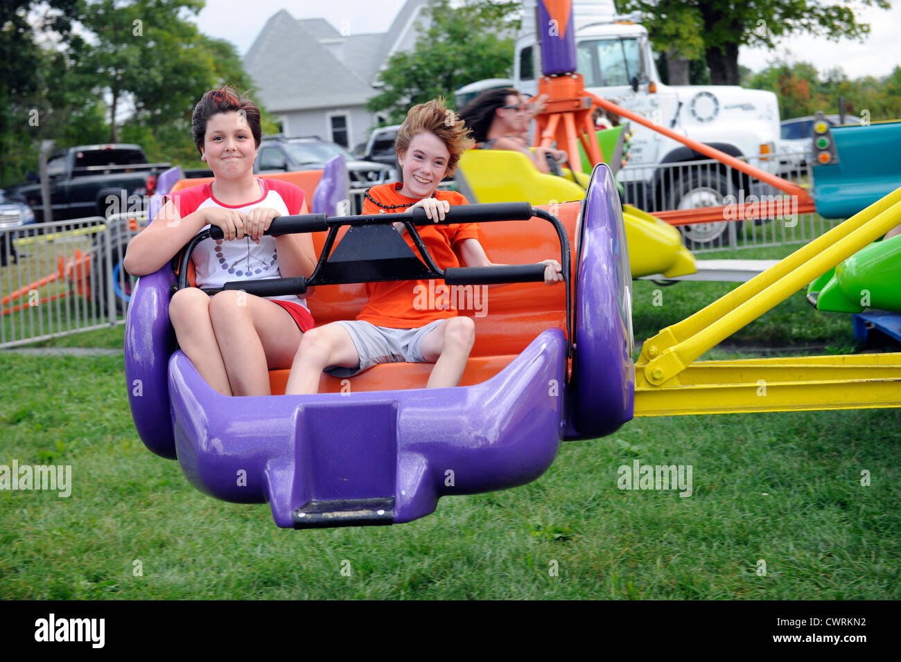 12 year olds on fair ride in Goshen Ct. Stock Photo