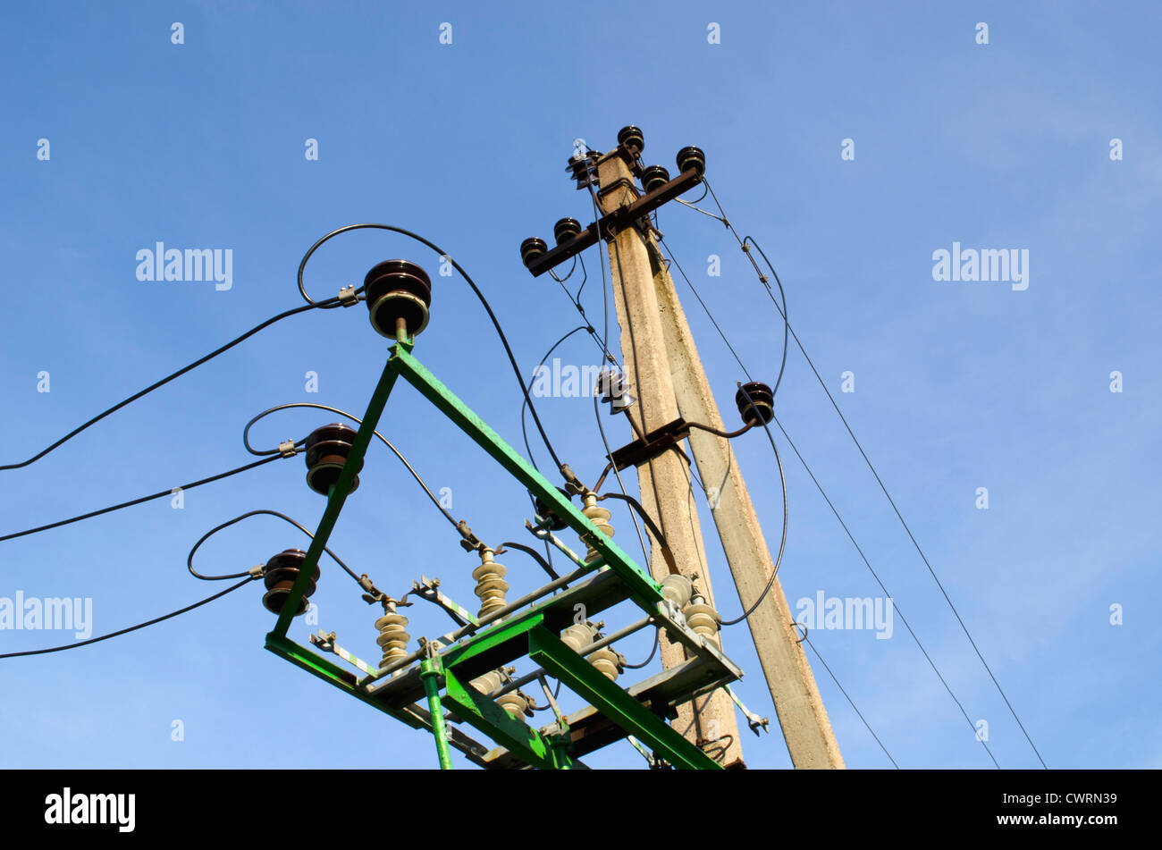 Electricity poles and wires on background of blue sky Stock Photo - Alamy