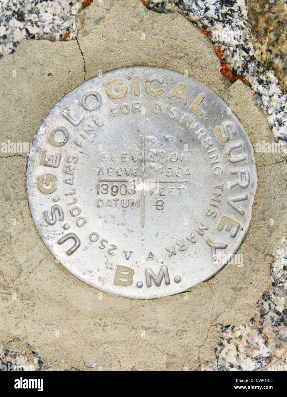 USGS bench mark on the 13903 foot summit of Junction Peak in the Sierra Nevada mountains Stock Photo