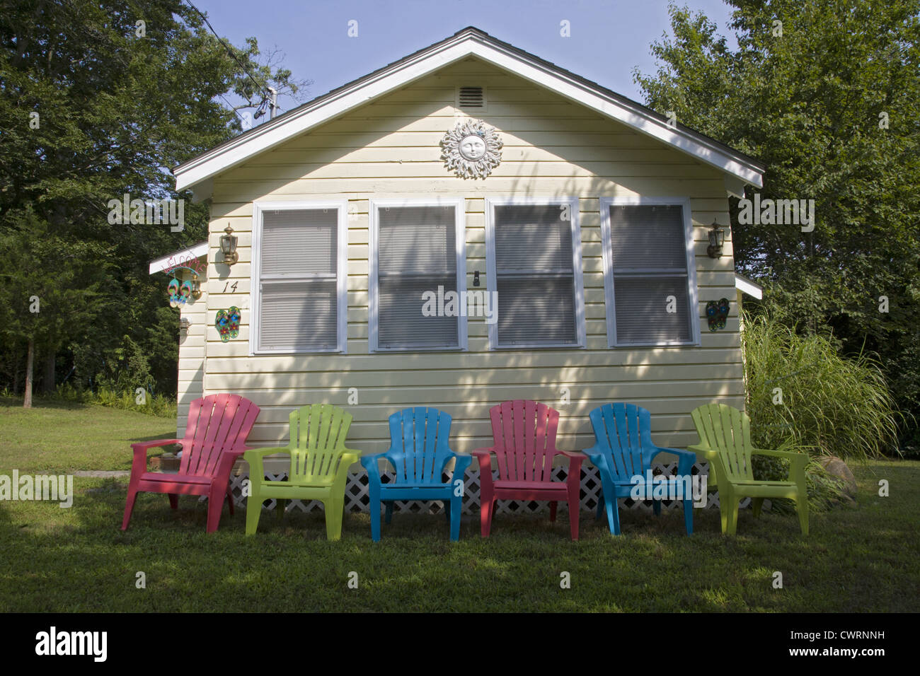 Small house with colorful lawn chairs, Riverhead, Long Island Stock