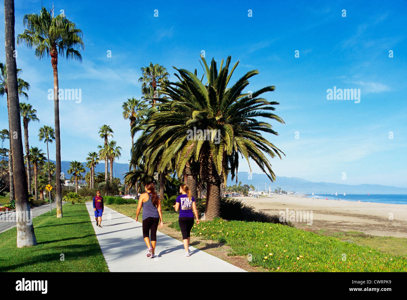 Santa Barbara, California, USA Women power walking on a Sidewalk in