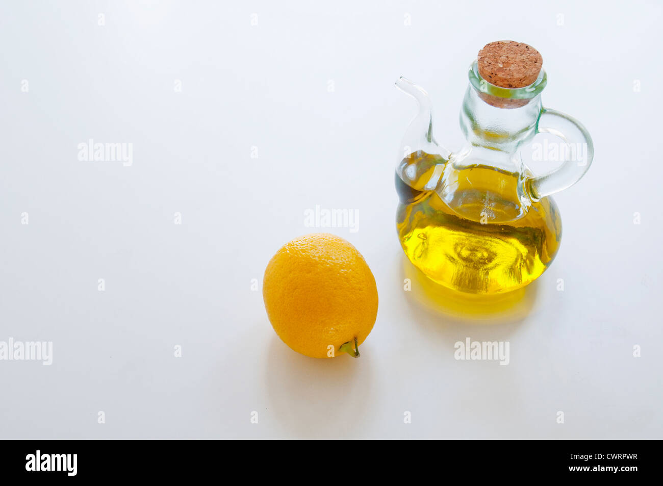 Lemon and olive oil. Still life. Stock Photo