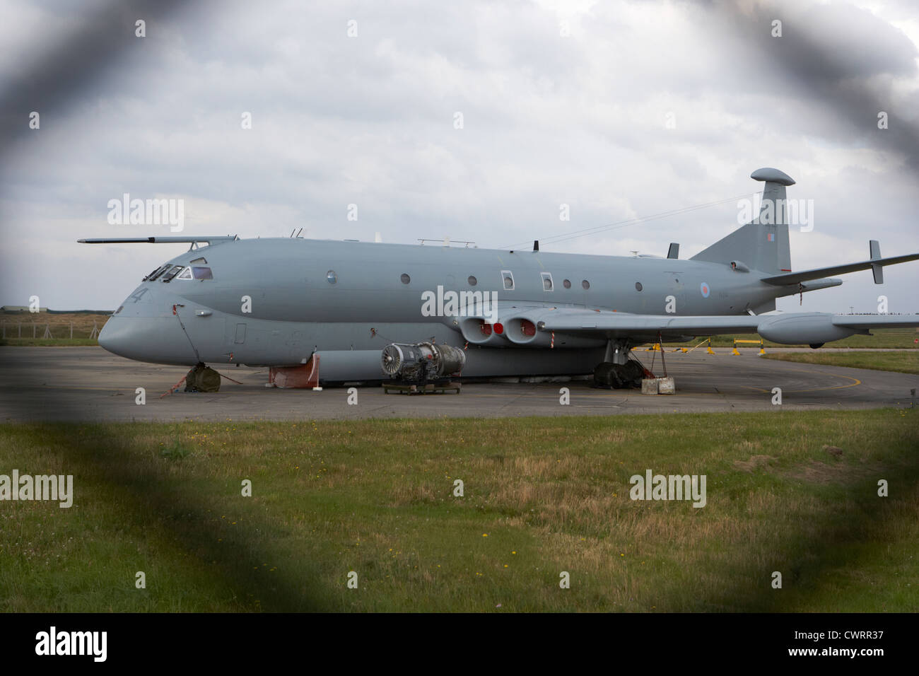 decommissioned RAF nimrod aircraft through the fence at former RAF Kinloss airbase scotland uk Stock Photo