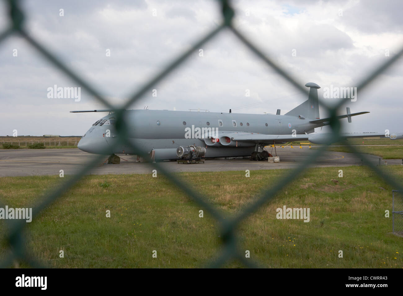 decommissioned RAF nimrod aircraft through the fence at former RAF Kinloss airbase scotland uk Stock Photo