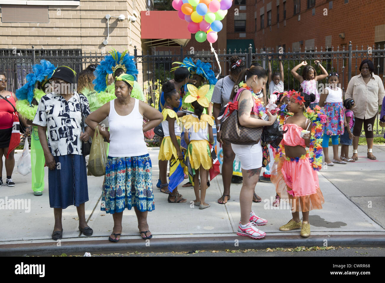 Participants and neighborhood onlookers at the West Indian Kiddies Parade in Crown Heights, Brooklyn, NY Stock Photo