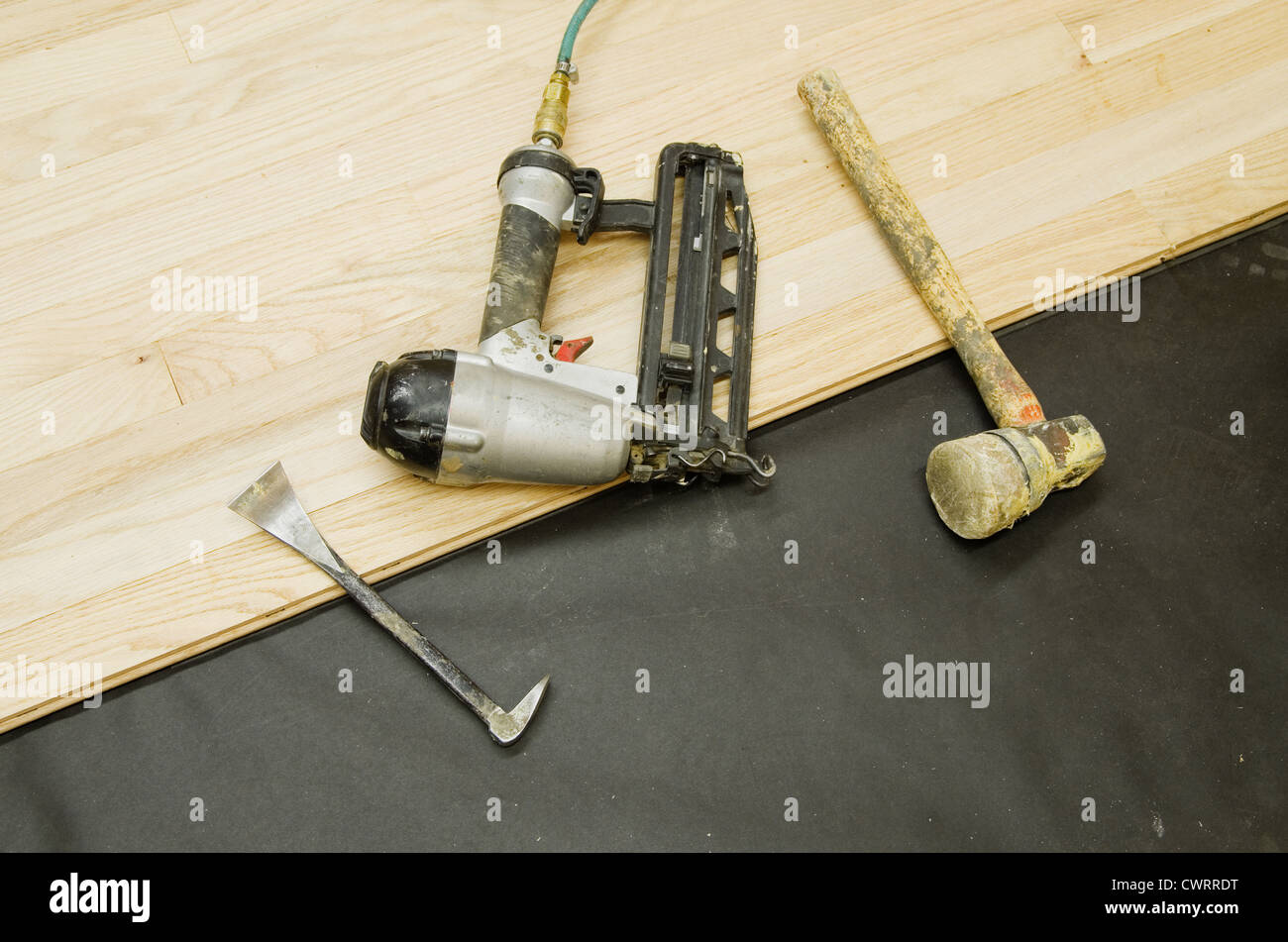 tools for the installation of hardwood flooring on a partly installed