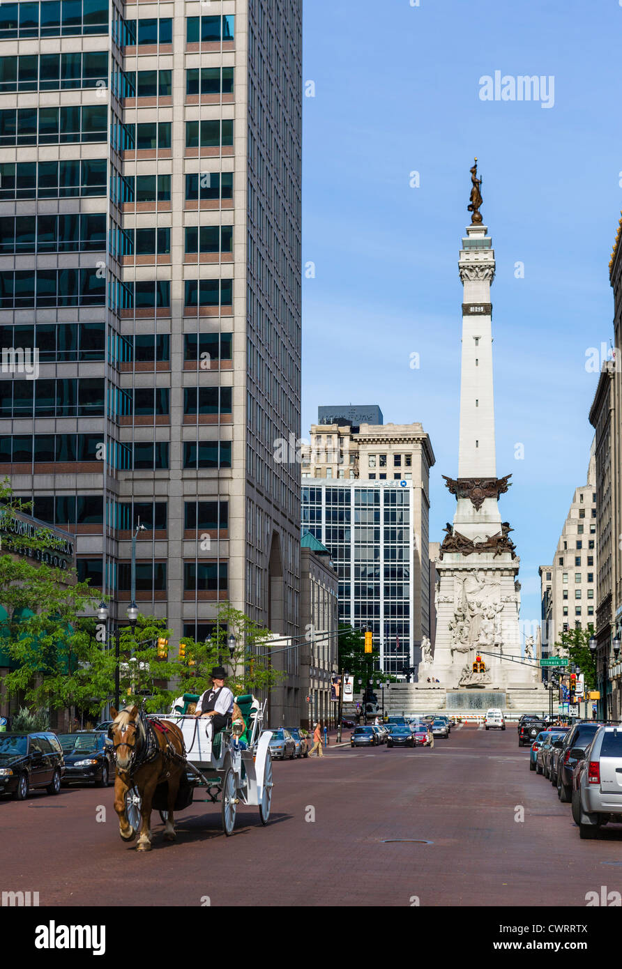 Horsedrawn carriage on W Market Street with Soldiers & Sailors Monument in Monument Circle behind, Indianapolis, Indiana, USA Stock Photo