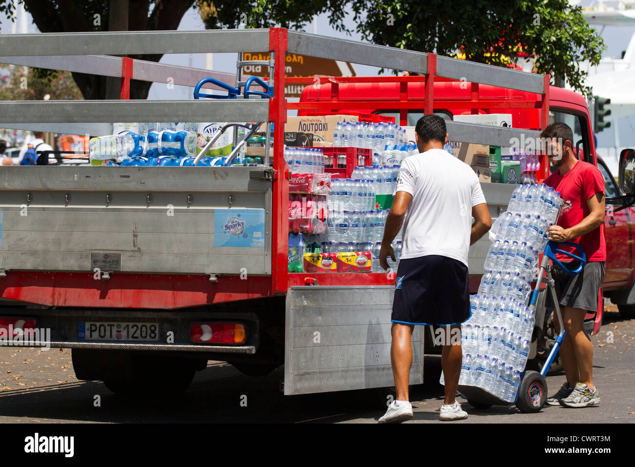 Soft drinks and water being delivered and loaded ready for resale to