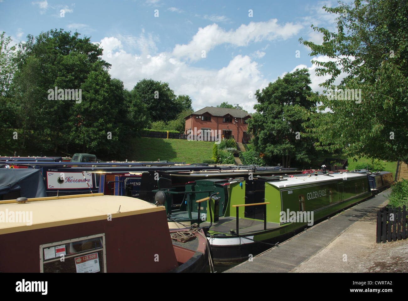 Collection of narrow boats for sale at Whilton Marina Stock Photo Alamy