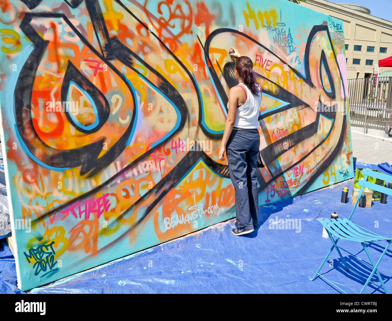 Female Graffiti Painter at Muslim Fest in Mississauga near Toronto;Ontario;Canada Stock Photo