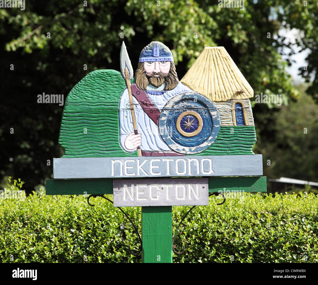 Village sign with bronze age warrior, Necton, Norfolk, England, UK