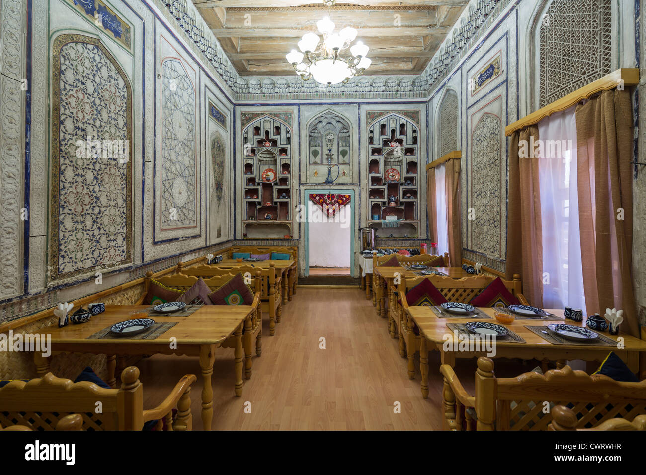 19th century dining room of hotel  in traditional style, Amelia Hotel, Bukhara, Uzbekistan Stock Photo