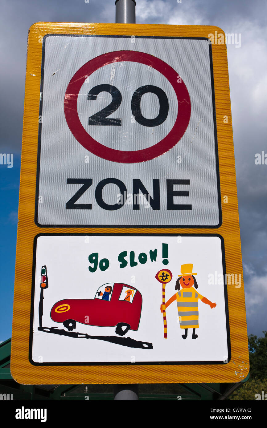 Traffic calming measures in the UK often include the use of children's drawings on speed limit signs in built-up areas. Stock Photo