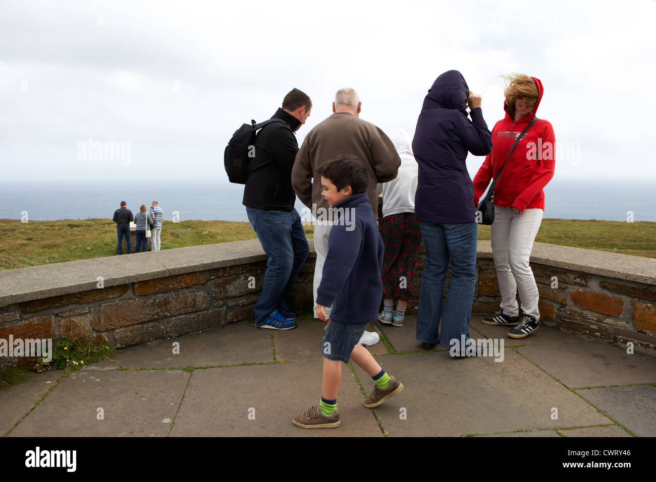 tourists at windy observation point on dunnet head most northerly point of mainland britain scotland uk Stock Photo