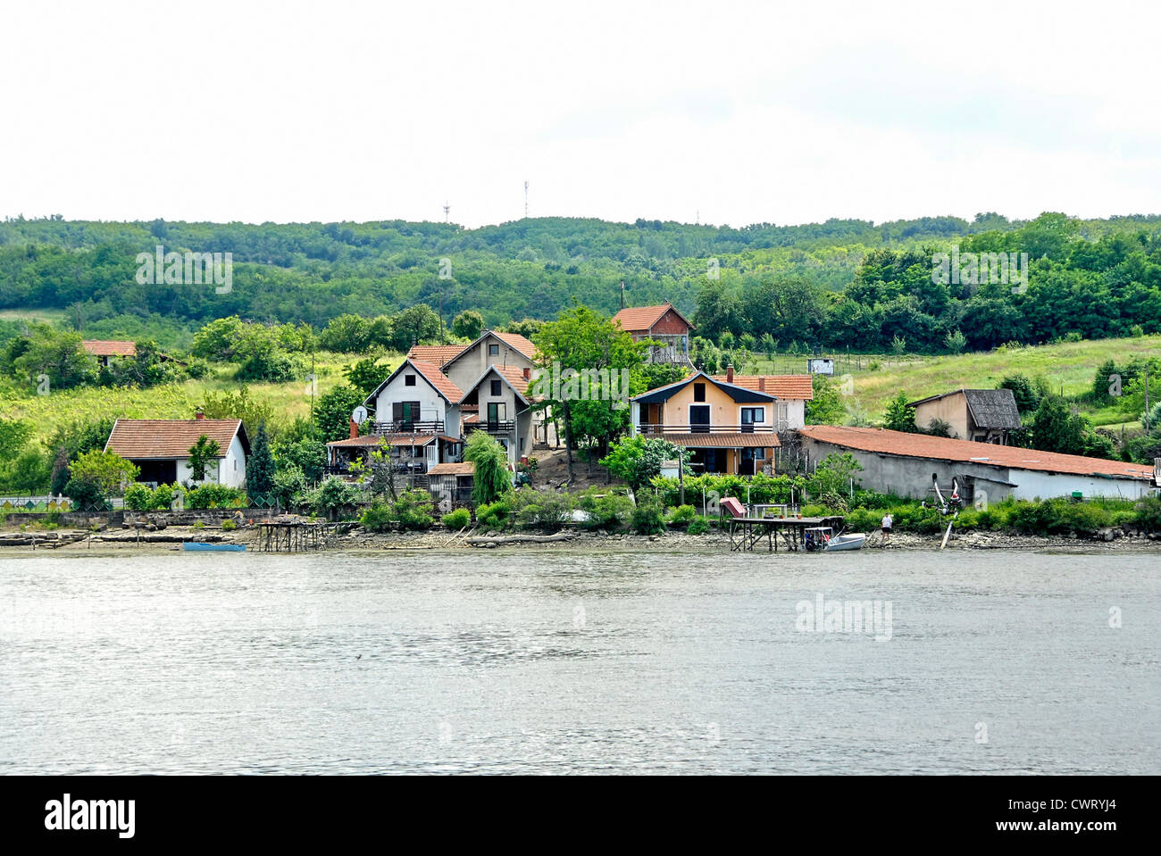 Village in the Iron Gates gorge on the Danube River between Romania and Serbia Stock Photo