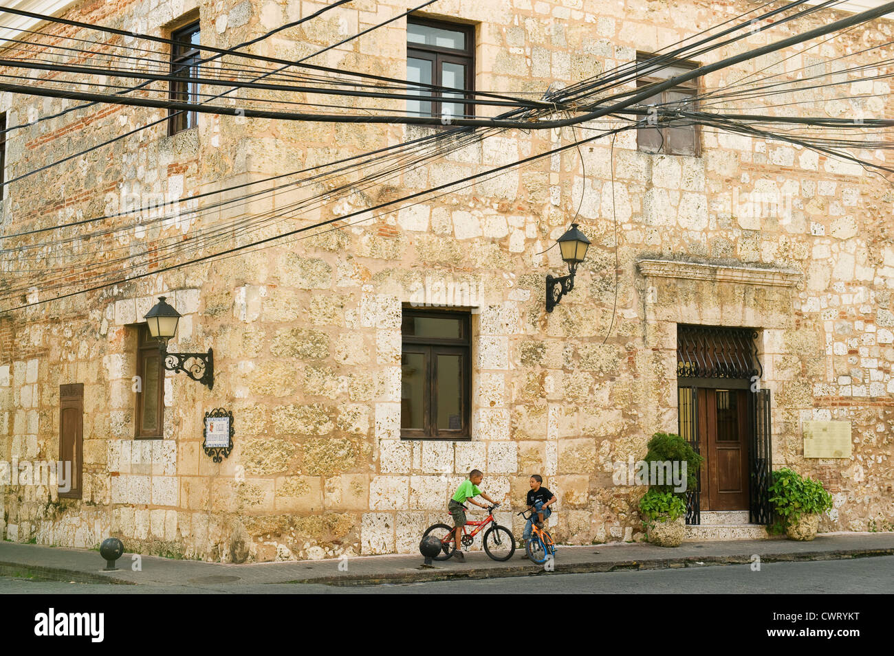 Dominican Republic, Santo Domingo, Colonial center, boys on bikes in historic district Stock Photo