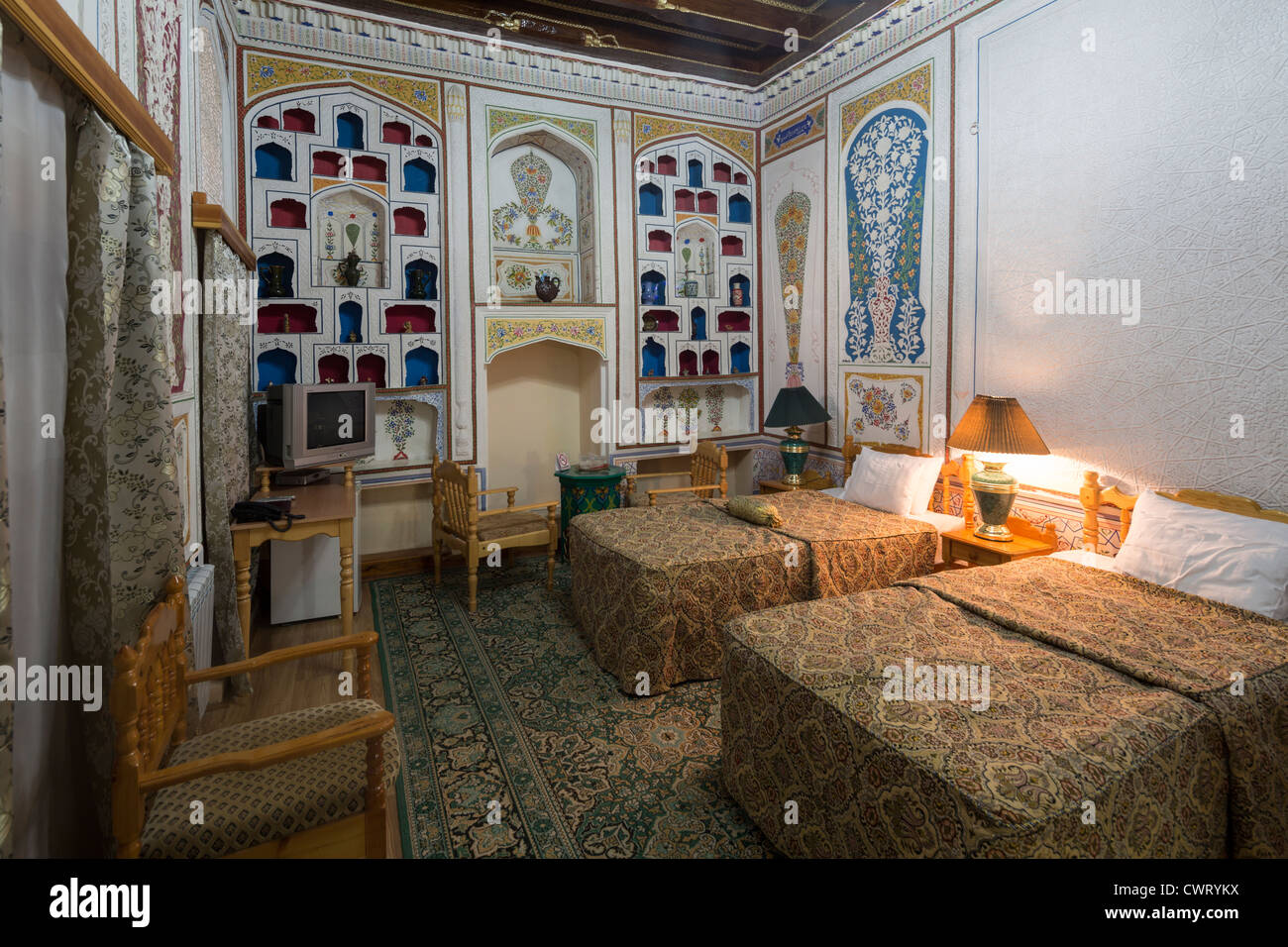 hotel bedroom in traditional style, Sasha and Son Hotel, Bukhara, Uzbekistan Stock Photo