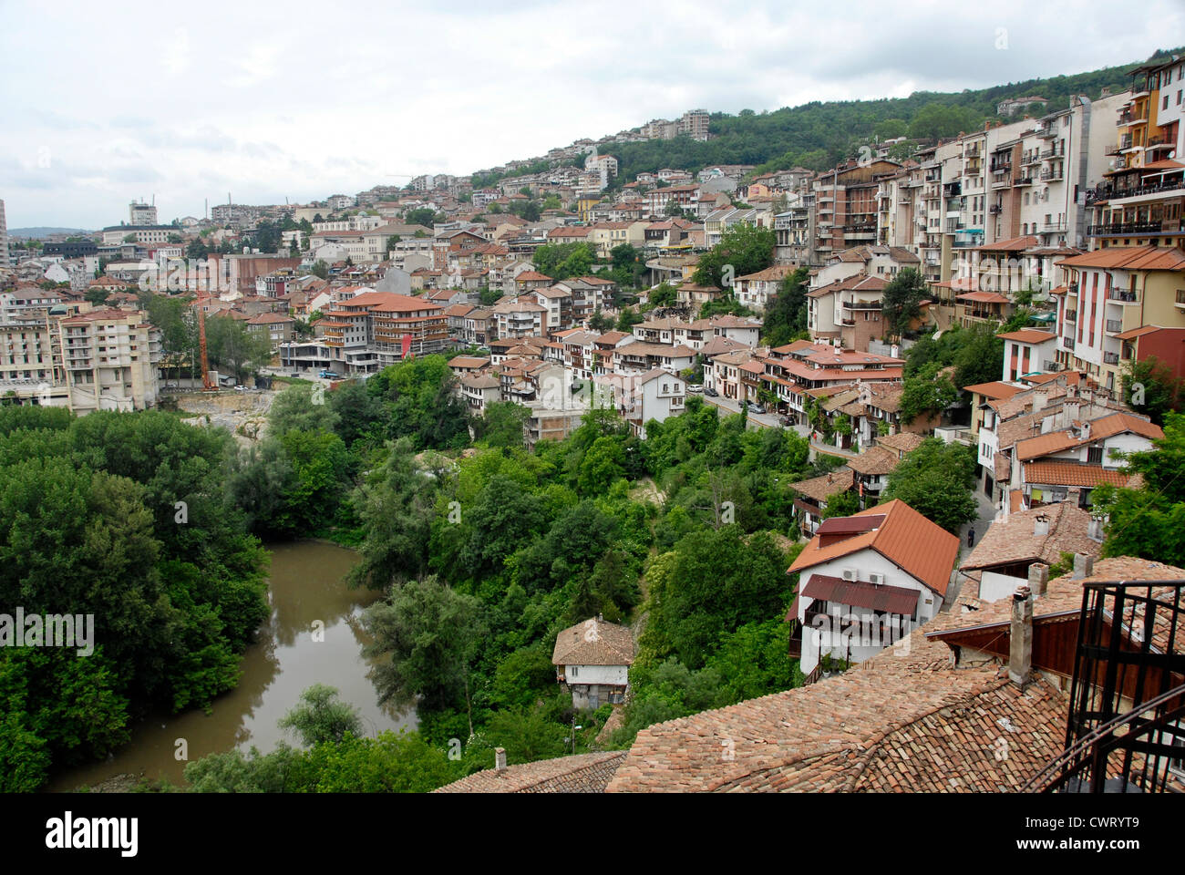 Houses on the bank of the River Yantra in the Old city of Veliko Tarnovo in Northern Bulgaria Stock Photo