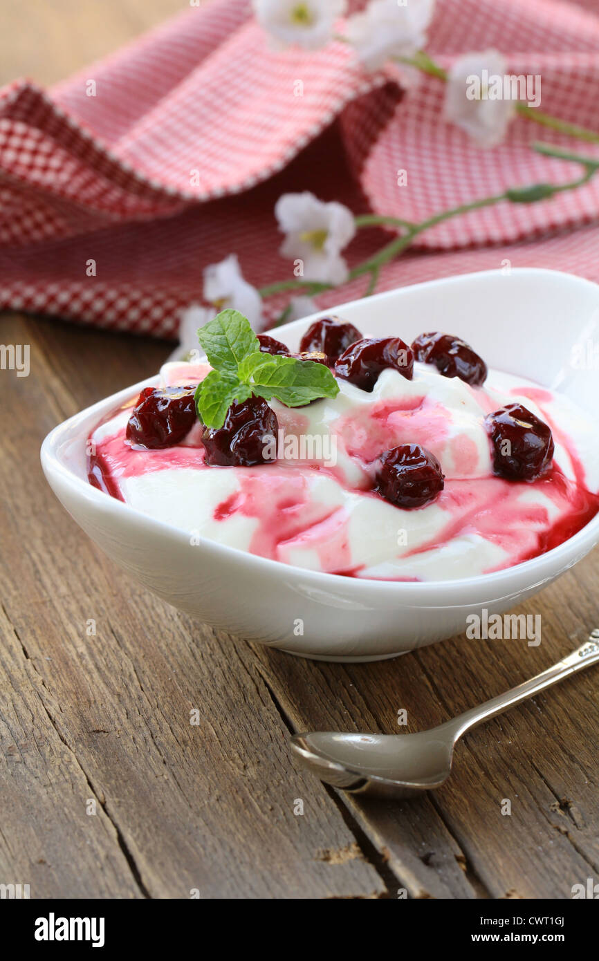 dairy dessert with sweet sauce and cherries Stock Photo Alamy