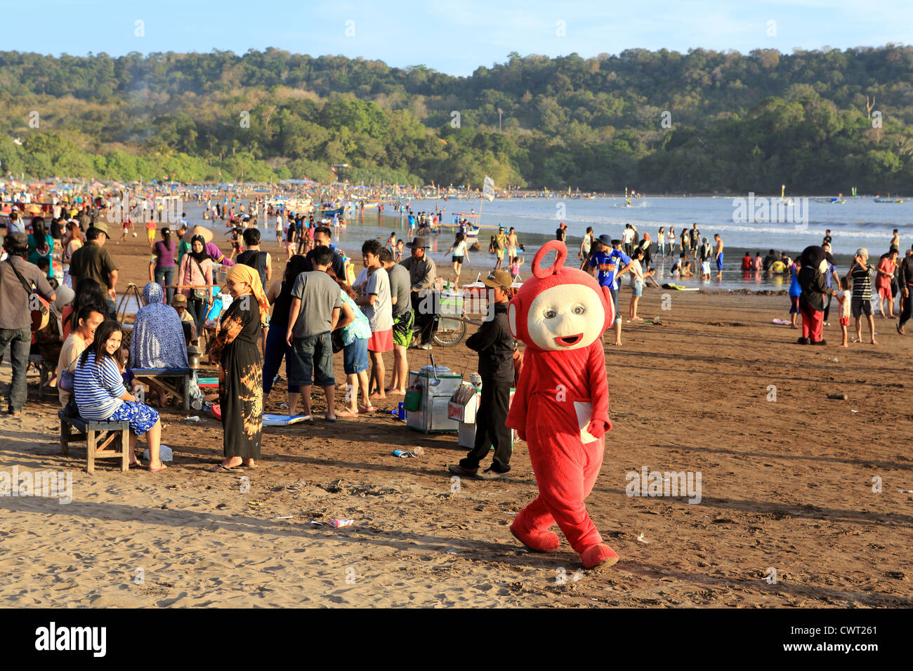 Teletubby Po on the beach in Pangandaran, West Java. Stock Photo