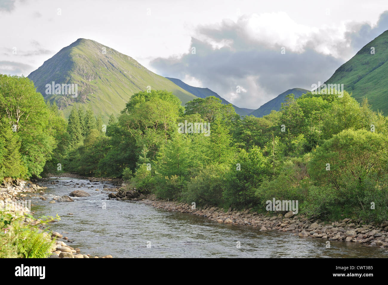 The River Coe runs through the mountains of Glencoe Stock Photo