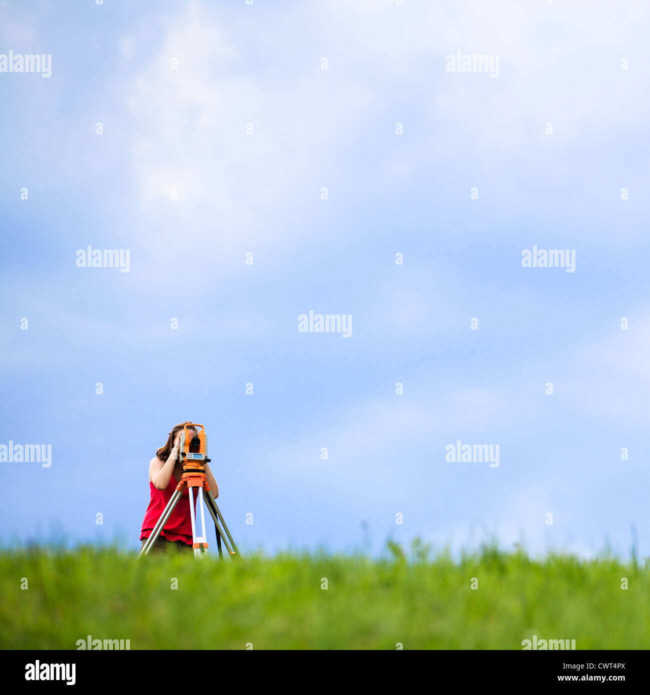 Young land surveyor at work Stock Photo