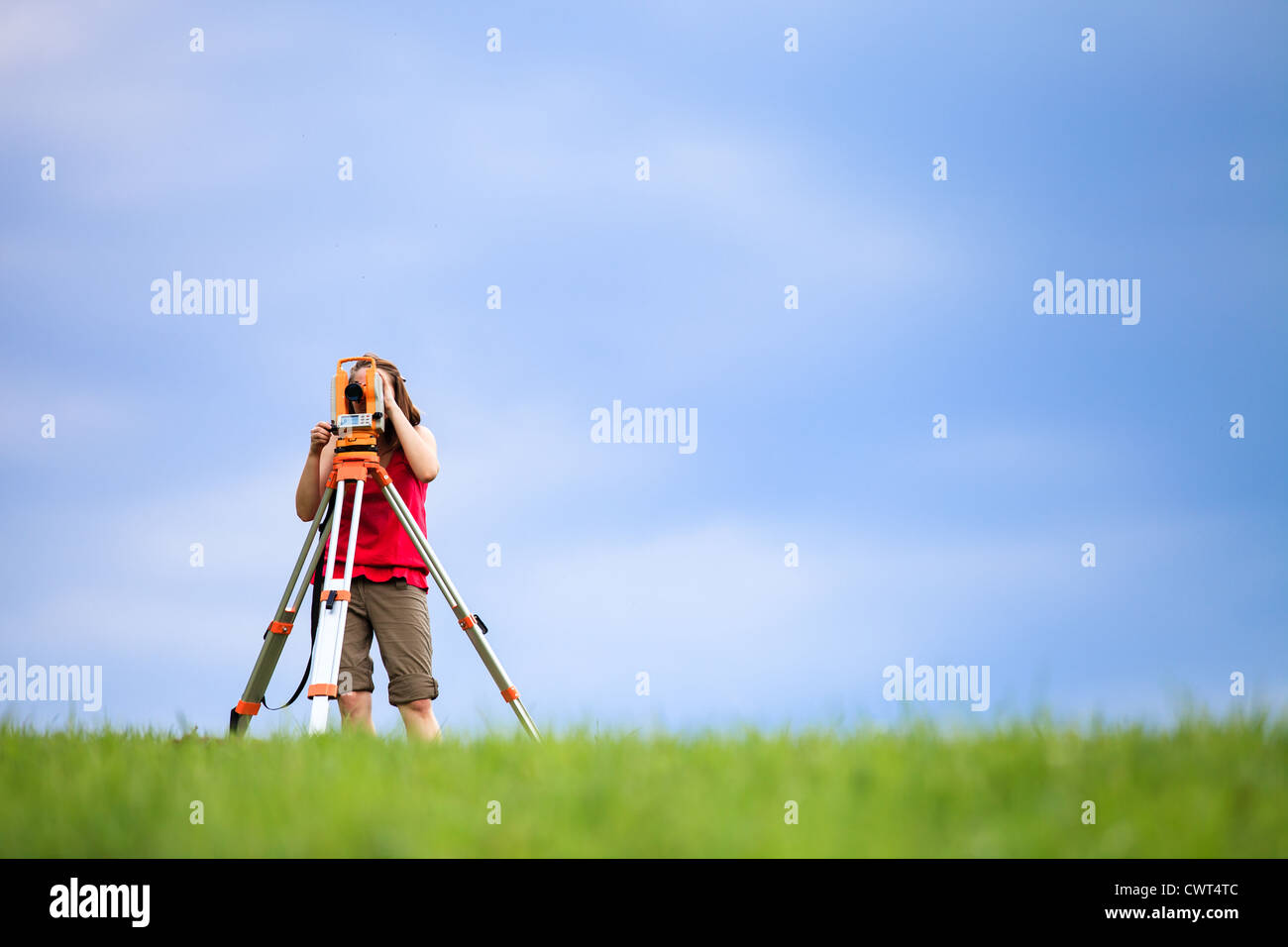 Young land surveyor at work Stock Photo