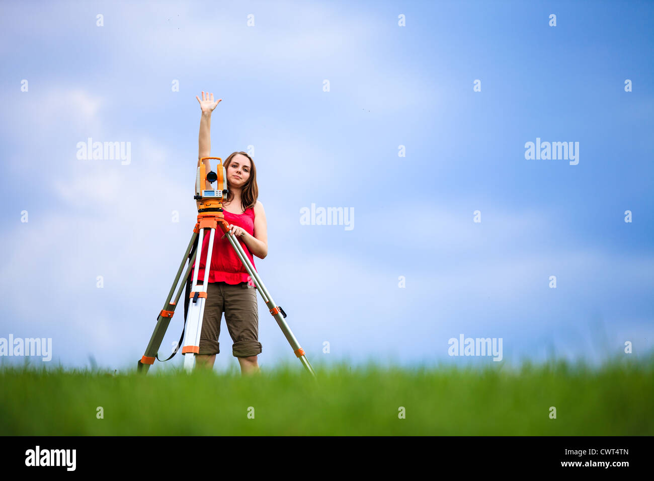 Young land surveyor at work Stock Photo Alamy