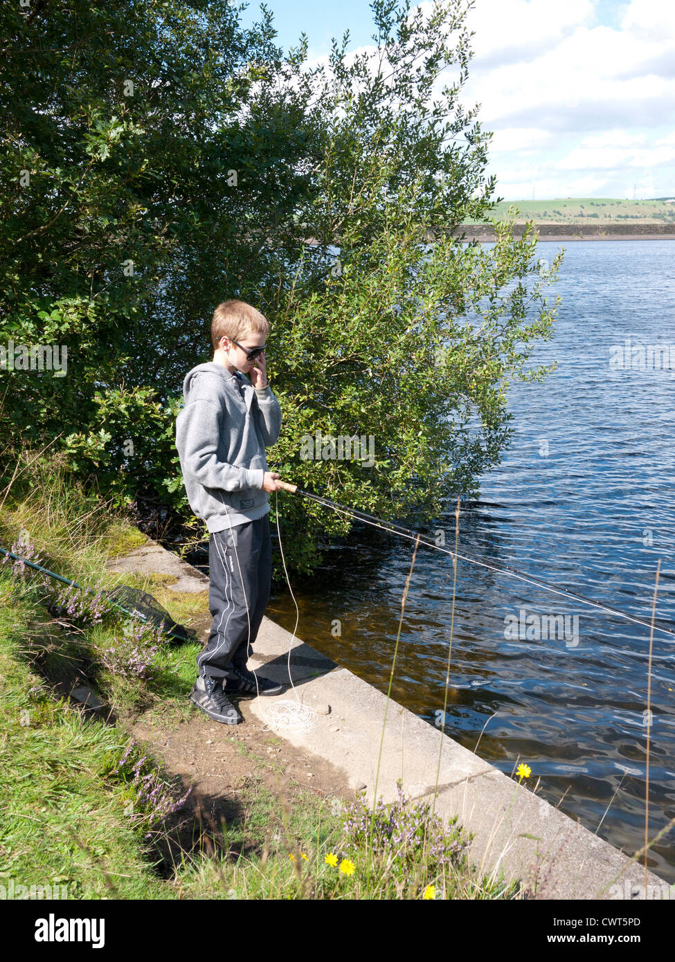 Young boy fly fishing England, UK Stock Photo Alamy