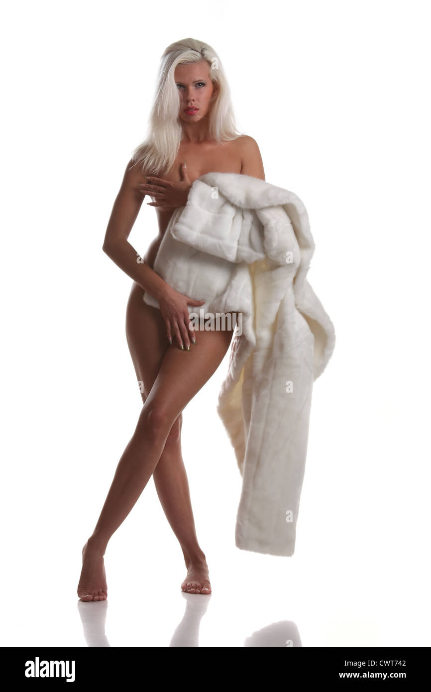 beautiful naked girl in a white fur coat Stock Photo