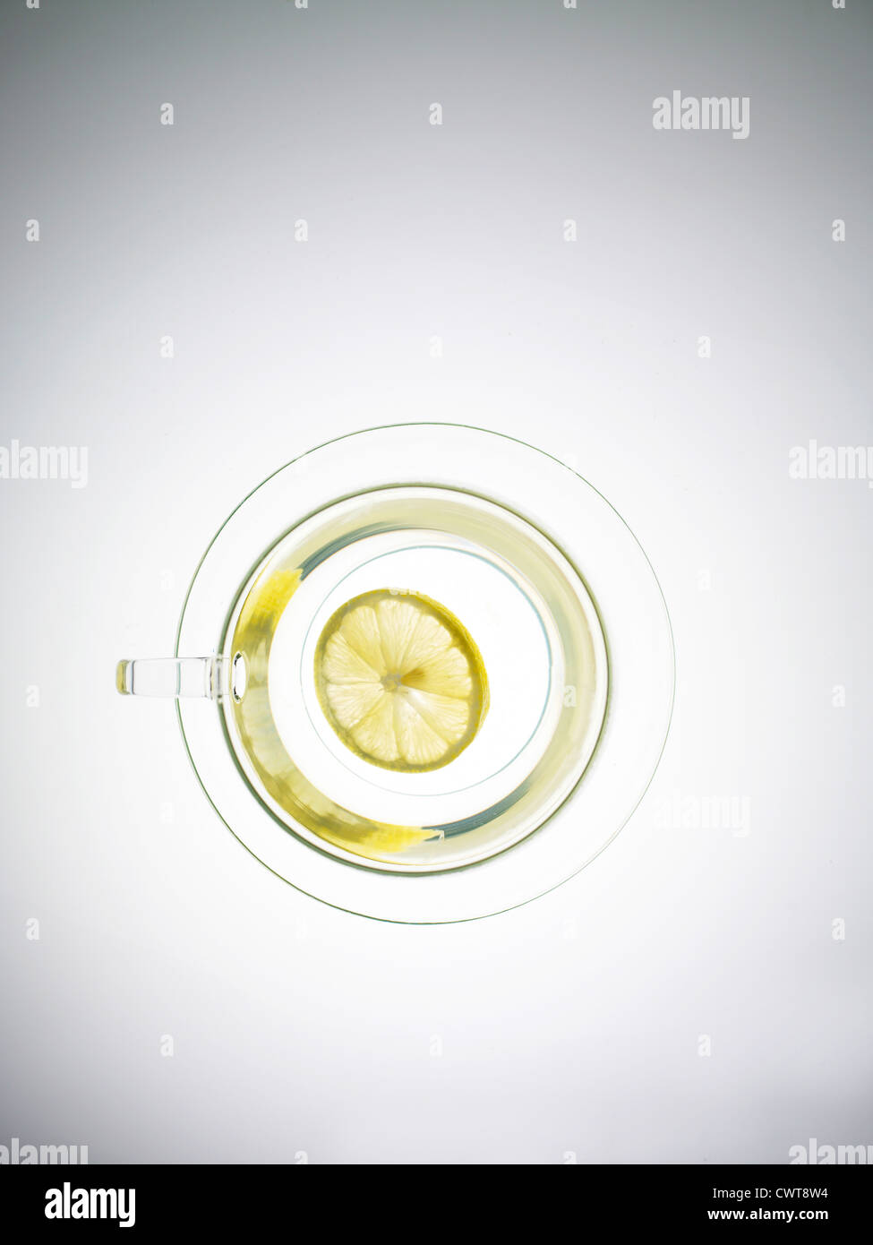 Slice of lemon in a transparent tea cup from overhead Stock Photo