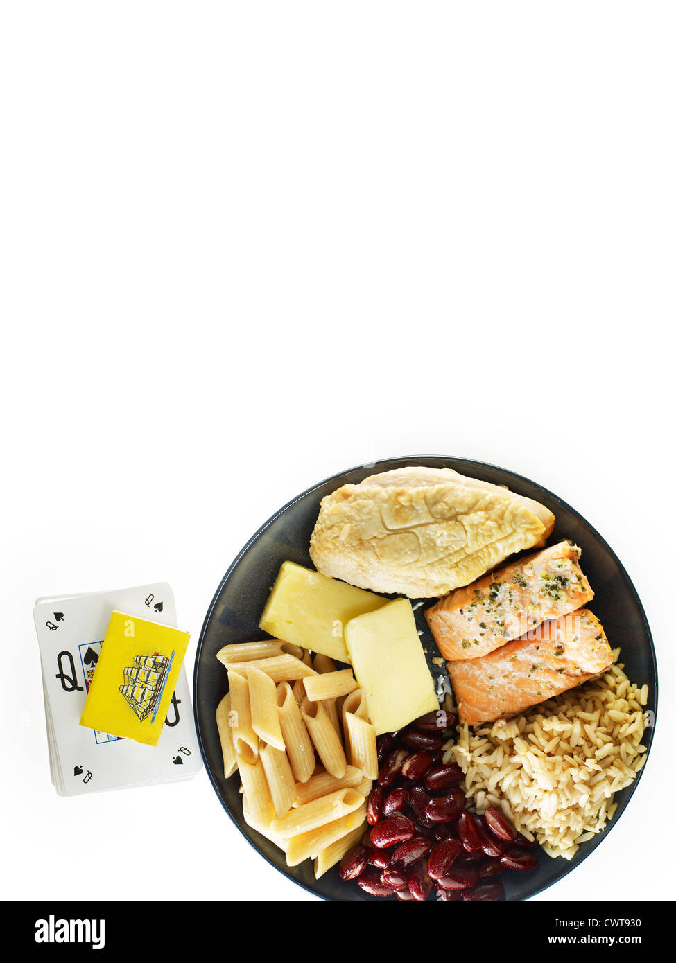 Plate of food next to matches and cards Stock Photo