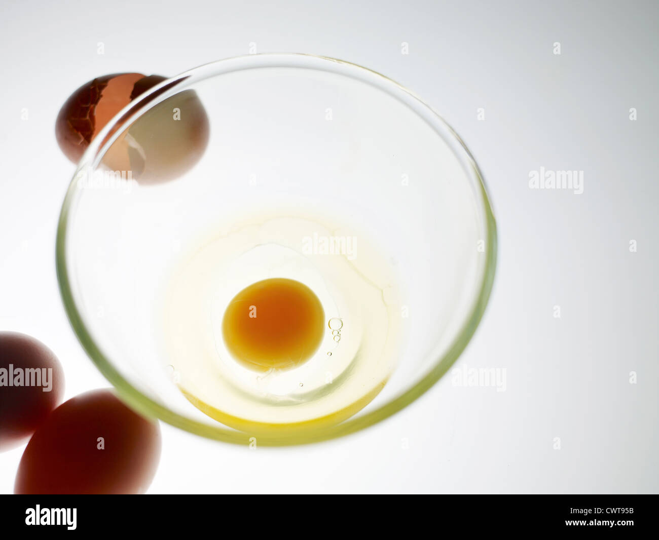 Broken egg in a mixing bowl Stock Photo