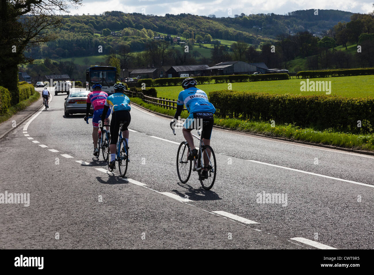 Cyclists on the busy A6 road through the Derbyshire Dales near Stanton in Peak, UK Stock Photo