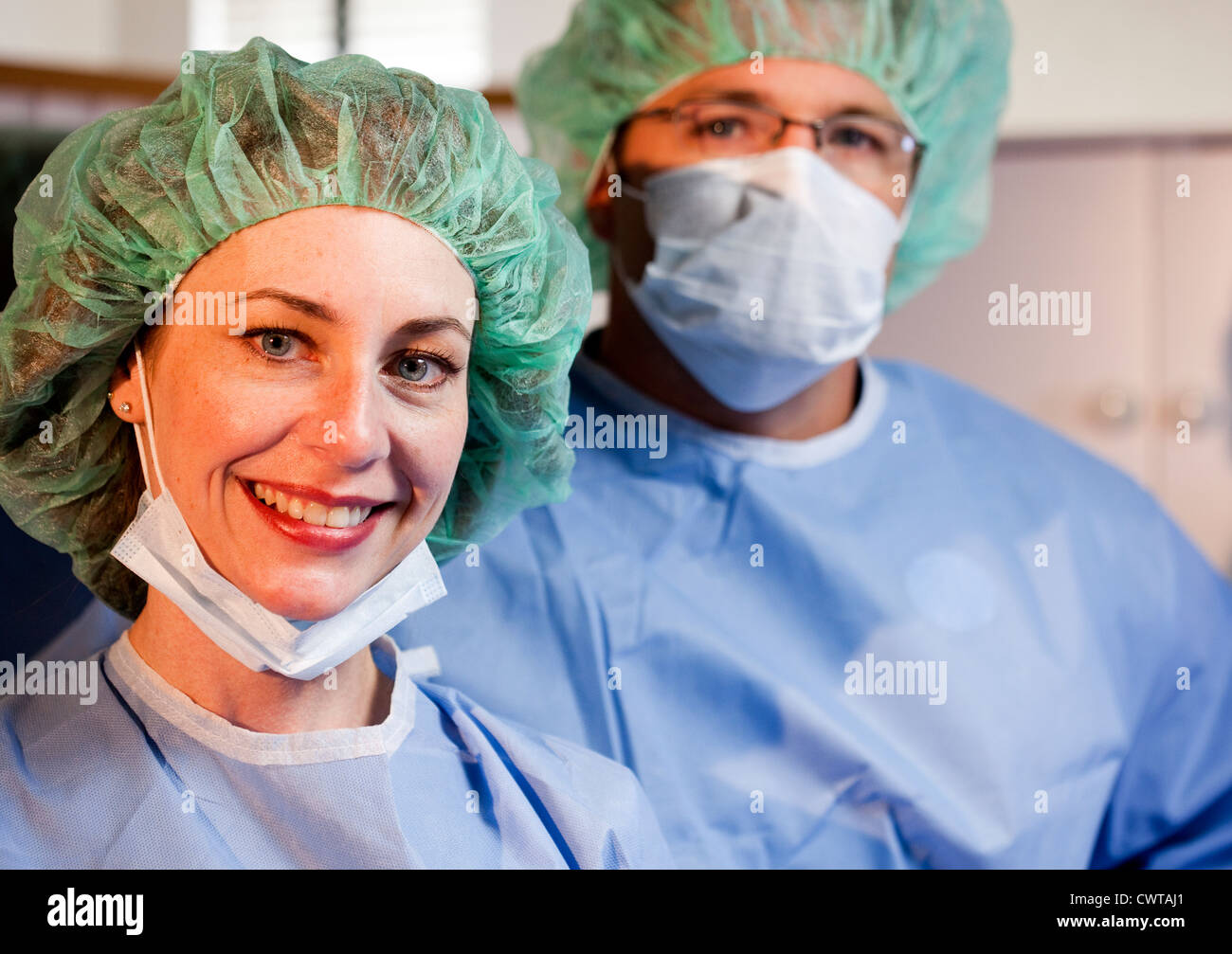 A woman surgeon smiles at camera Stock Photo - Alamy