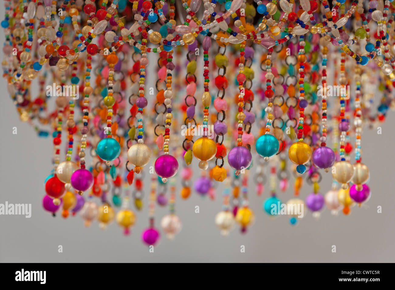 brightly coloured beads as a lampshade Stock Photo
