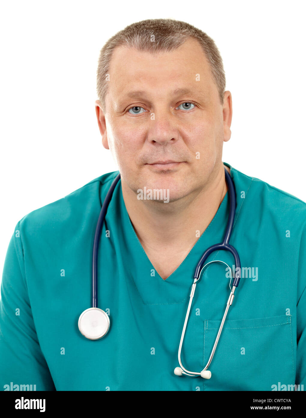 The portrait of a 50-year-old, blue-eyed doctor in a green smock with a stethoscope. Caucasian. Isolated on white. Stock Photo